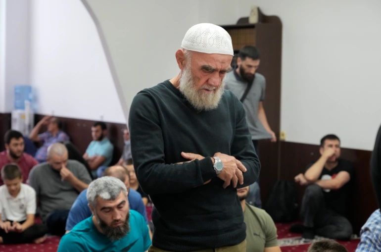 Crimean Tatars pray at mosque in Ukraine’s capital, Kyiv, on August 13 [File: Efrem Lukatsky/AP Photo]