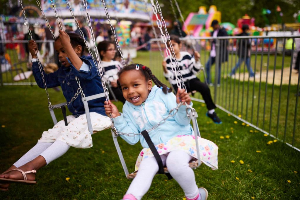 Children on a carousel at Eid in the Park in Platt Fields, Manchester
Photograph: Christopher Thomond/The Guardian