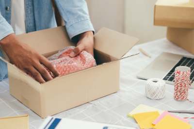 Person Packing Merchandise for Shipping-Selling Merchandise to Someone Who Deals with Interest