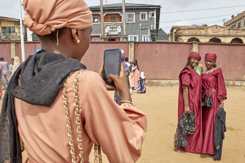 Nigerians take a photo in their traditional clothes during Eid al-Fitr prayers in Lagos, Nigeria, on May 2. 