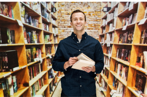 male-librarian-in-library-Can You Work as Librarian in Christian University?
