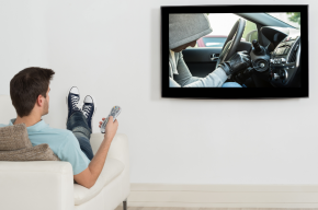 man-watching-movie-on-television-Is Watching Movies with False Gods Permissible in Islam?