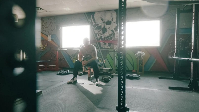 Richard “Mac” McKinney in the gym in the documentary “Stranger At The Gate.” Photo by Karl Schroder