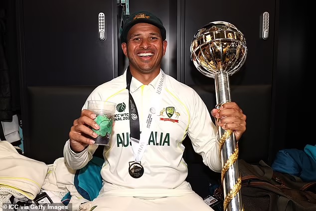 Usman Khawaja celebrating with coke