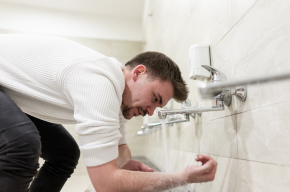 A man making wudu-Obligatory Parts of Wudu