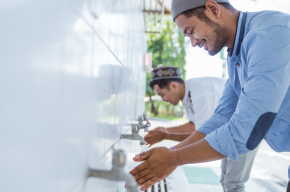 Two muslim men making wudu-What Necessitates Wudu