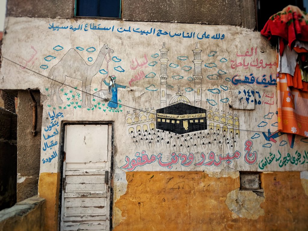 Source: https://scoopempire.com/egypts-hajj-murals-a-tradition-worth-celebrating/