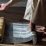 Muslim rolling out a prayer rug-Importance of prayer in Islam