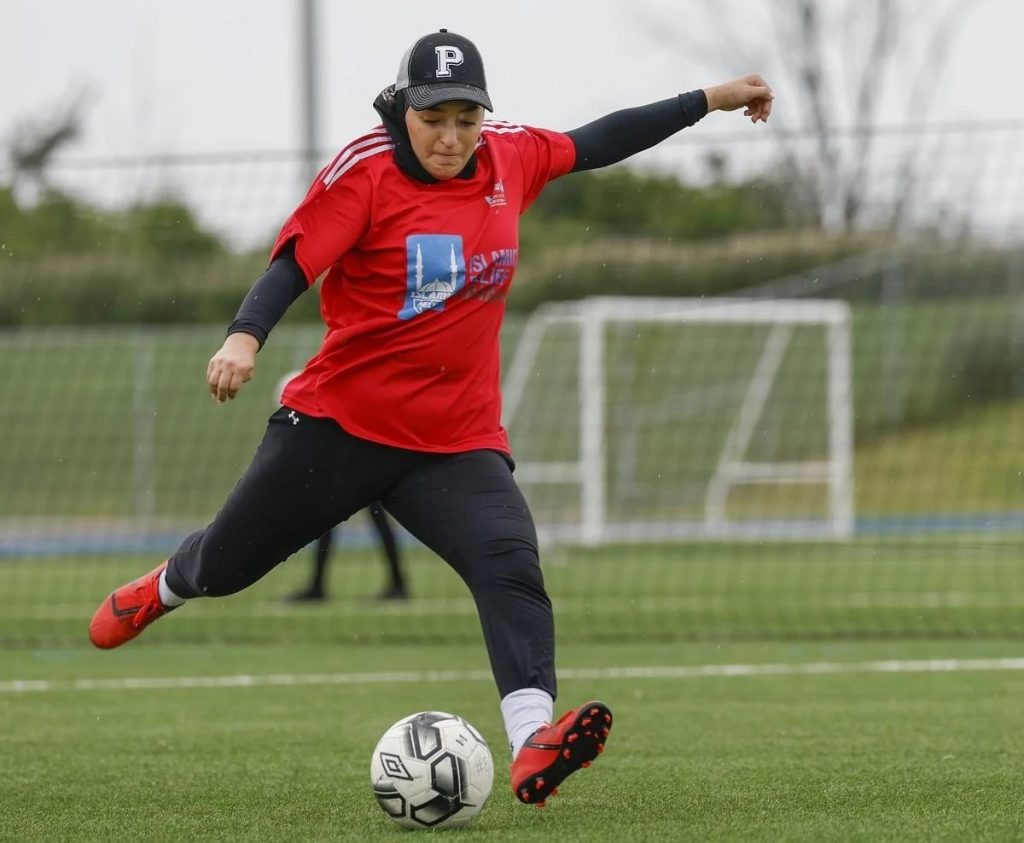 Malak Aiad warms up before an afternoon match in a soccer league for Muslim women. (Rick Madonik)