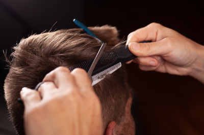 barber cutting client's hairh