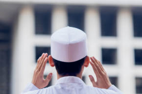 Young muslim man giving adhan in mosque -virtues of adhan