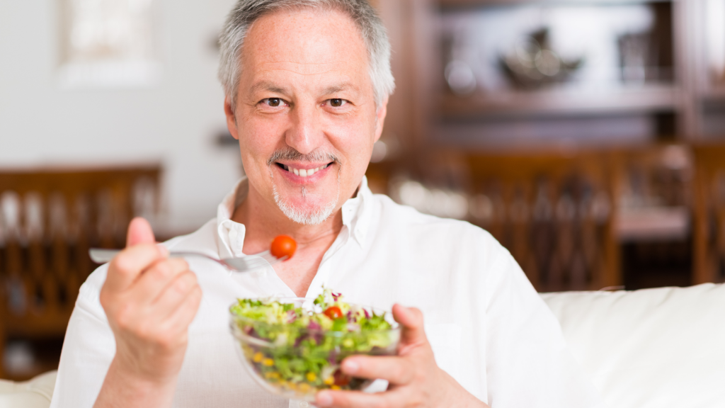 man eating salad-Can Muslims Eat at a Non-Muslim's House?