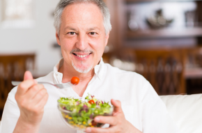 man eating salad-Can Muslims Eat at a Non-Muslim's House?