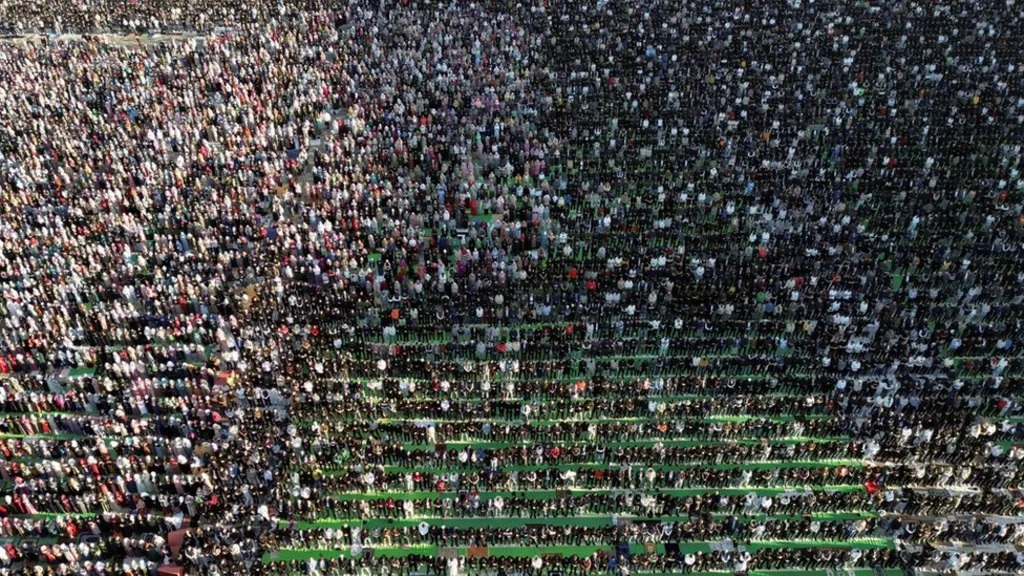 Thousands knelt in prayer in Skanderbeg Square in Tirana, Albania.