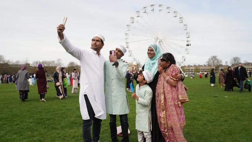 A family take a selfie in Cambridge, UK.