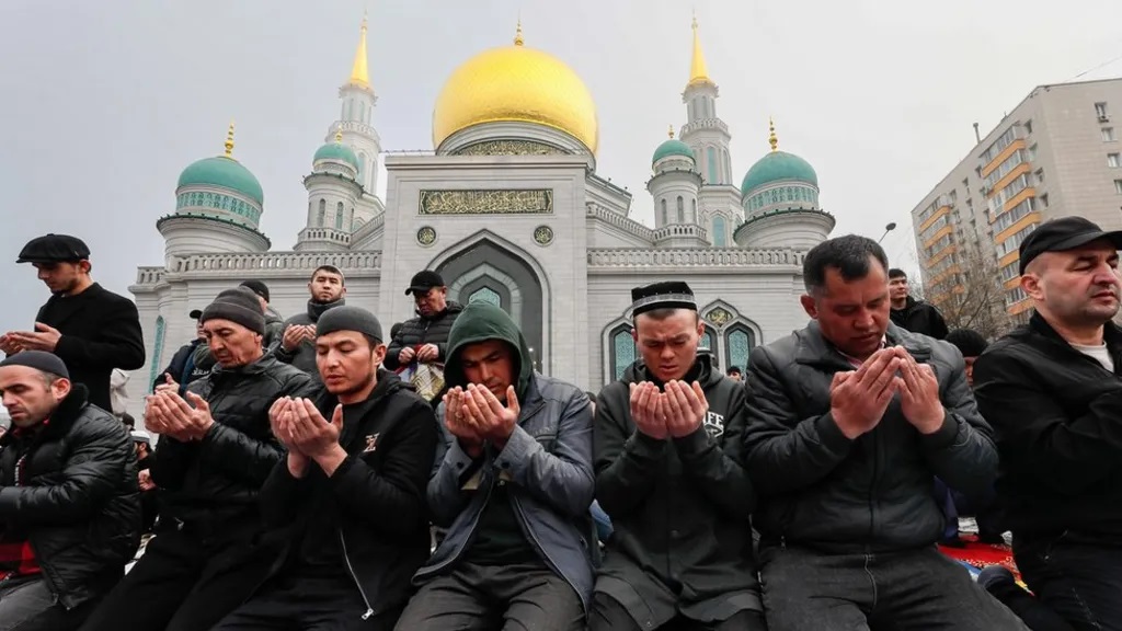 In the Russian capital, Moscow, worshippers pray outside the Central Sobornaya Mosque.