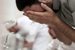 Muslim man making wudu