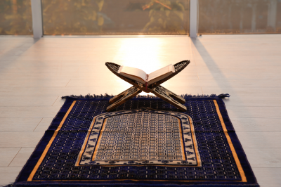 open quran on prayer mat-Who Must Pray in Islam?