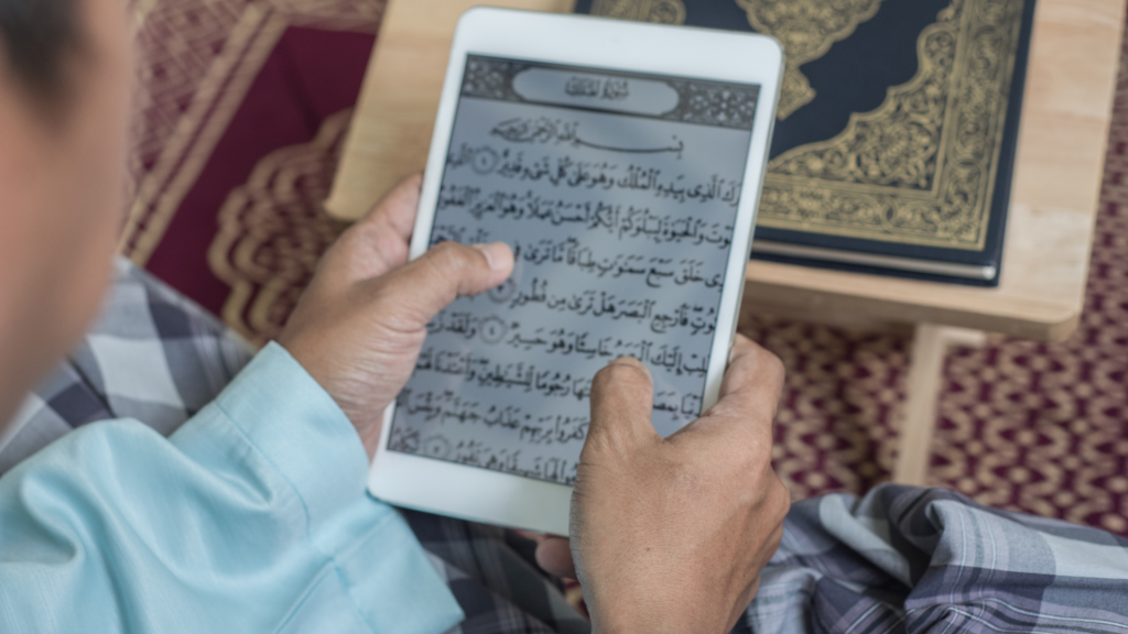 somene reading quran on tablet