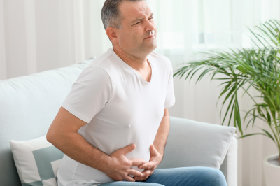 Mature man suffering from abdominal pain