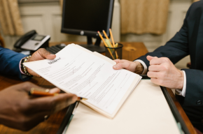 a man holding divorce paper