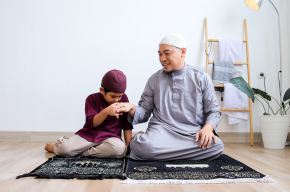 child kissing father's hands