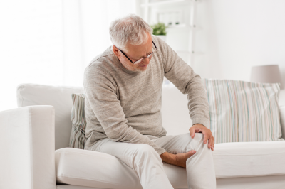 senior man suffering from knee pain