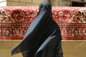 back view of woman in black abaya