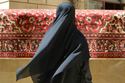 back view of woman in black abaya