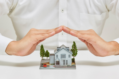 hands protecting miniature of house model- How Islam Balances Personal Piety and Relationship Responsibilities